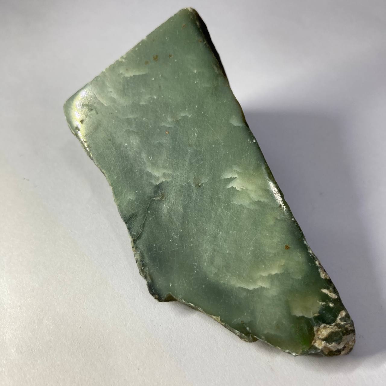 Green jade stone on a white background