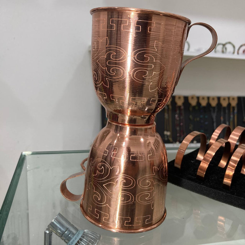 tow copper cup on top of each other 