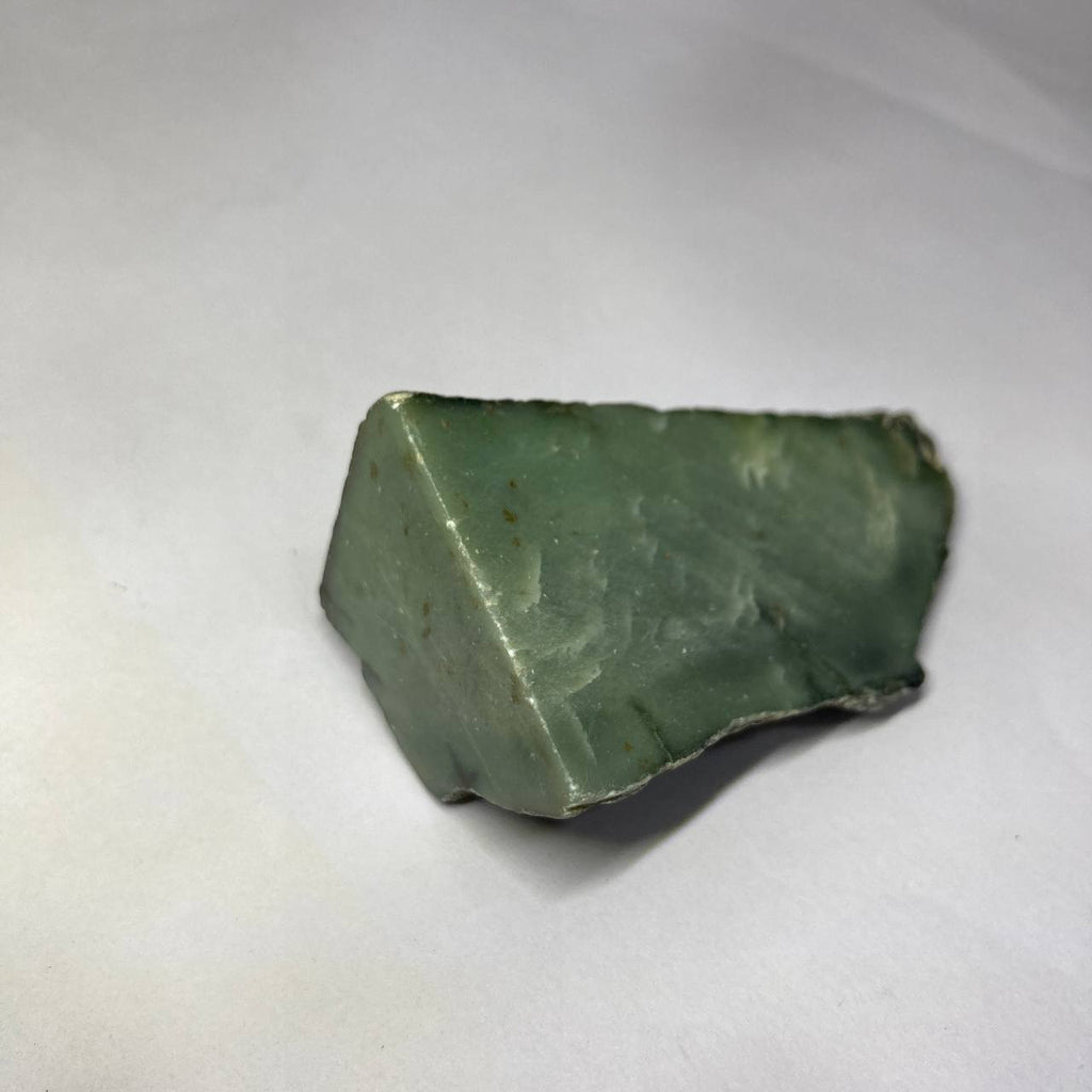 Green stone on a white background