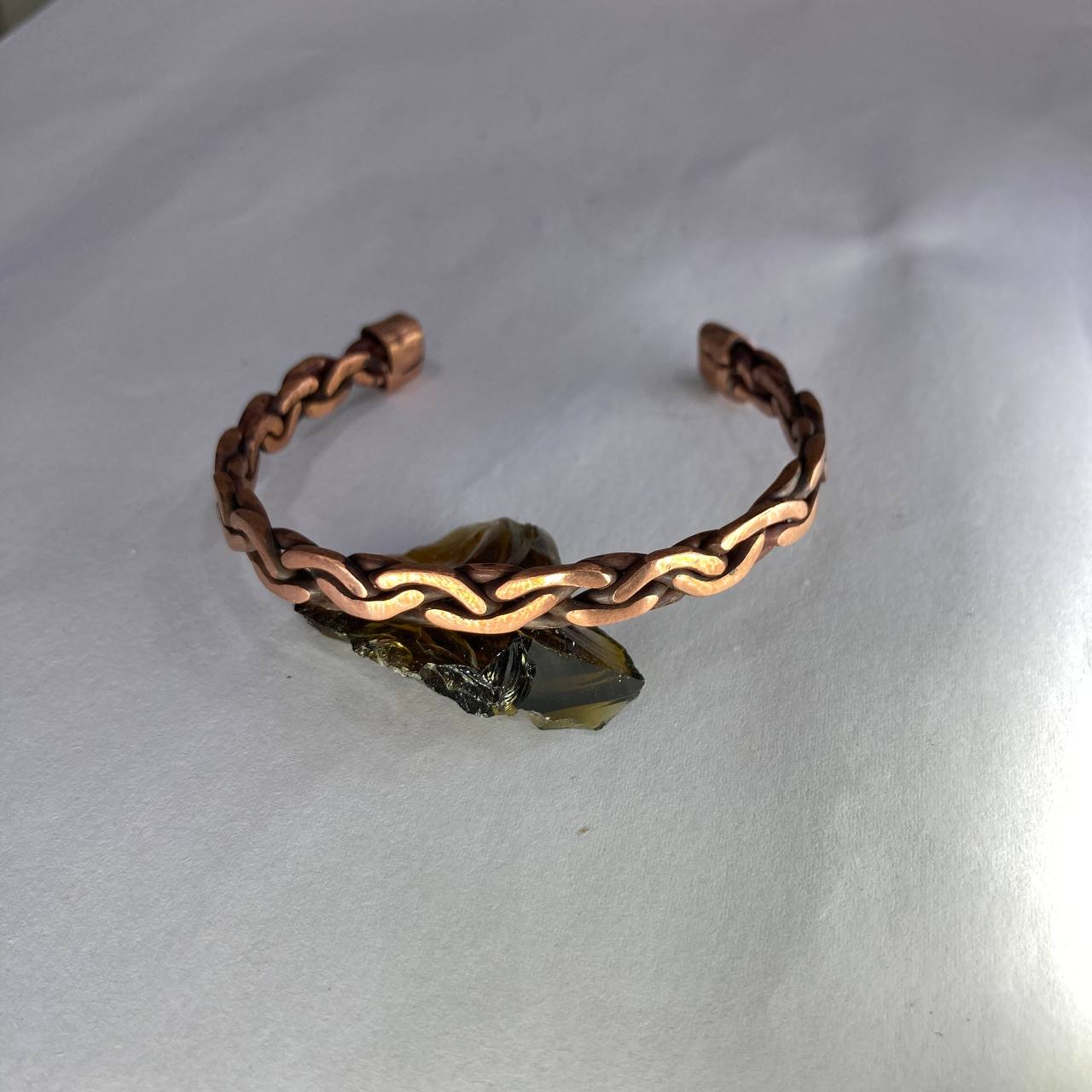 Copper bracelet on a white background