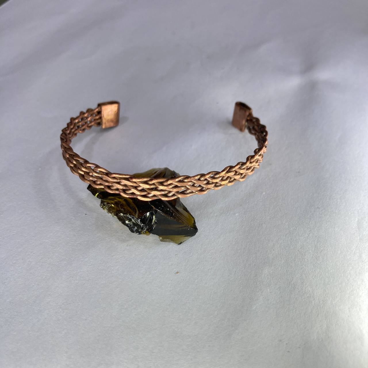 Copper bracelet on a white background